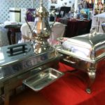 serving pieces Silver serving pieces including a beverage dispenser and food warmer, ideal for event catering, showcasing elegance for weddings and parties.